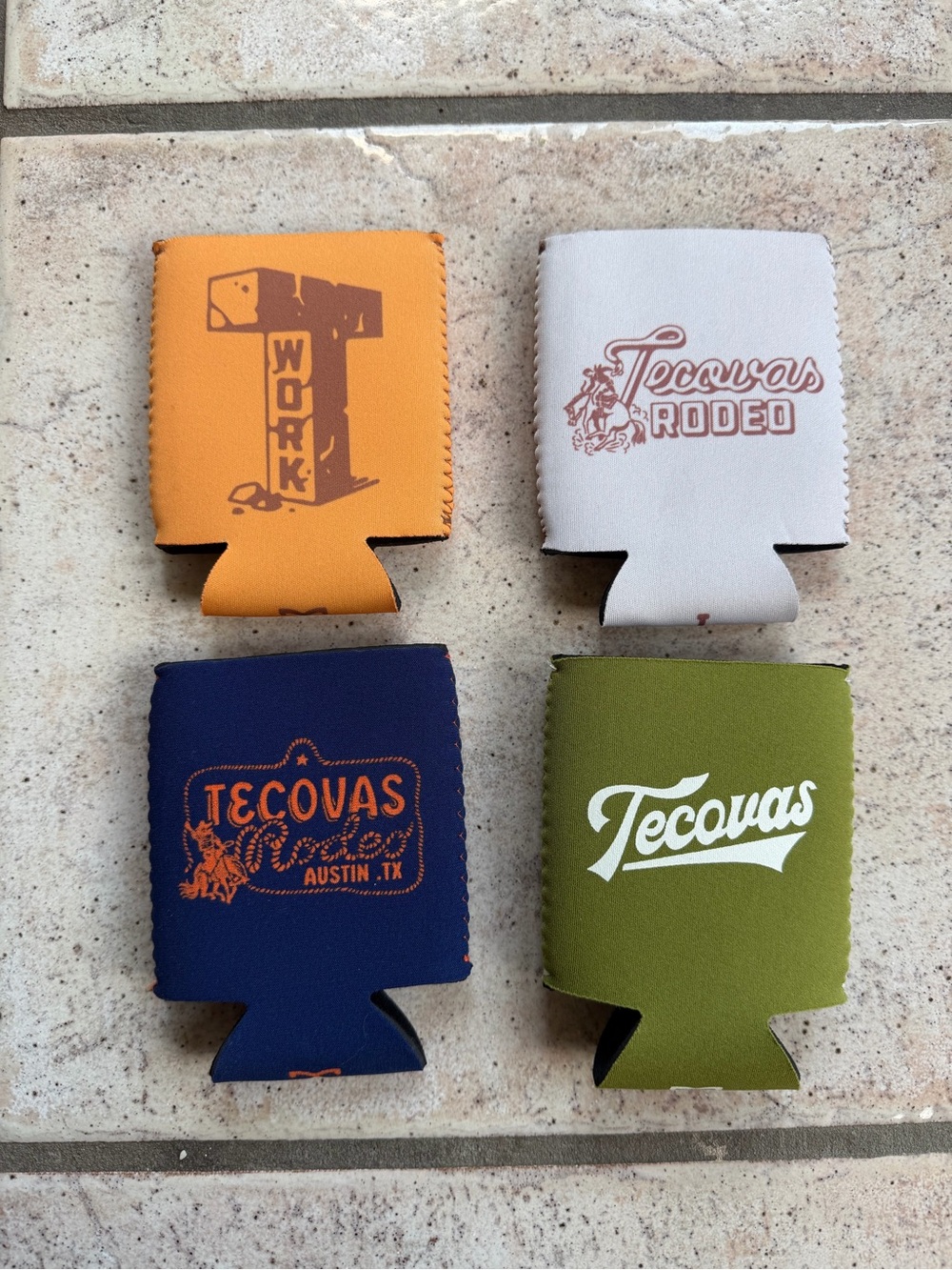 Tecovas Neoprene beer cosies in Orange, Gray, Navy & Olive